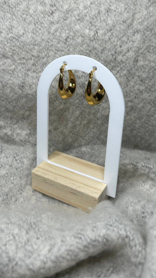 Boucles d'oreilles dotées d'une forme arrondie dorée, faites en acier inoxydable