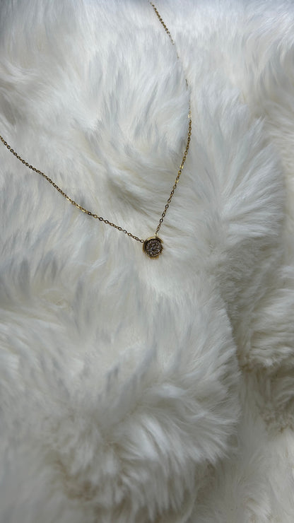 Collier pendentif rond fait de Zirconium et d'acier inoxydable